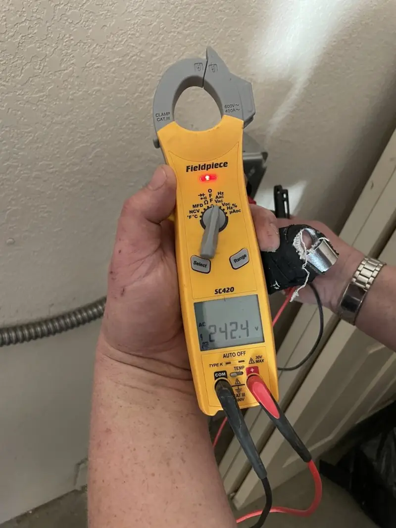 Voltage testing with clamp meter during Outlet Installation in Richfield